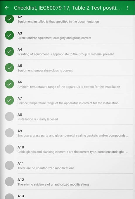 Tablet checklist screen with green ticks beside completed inspection items and grey circles beside open ones